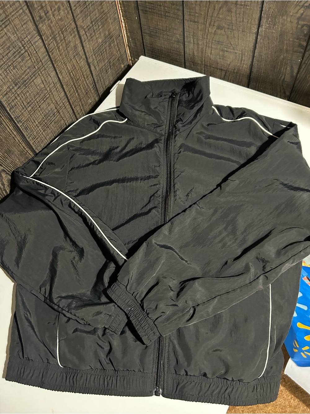 Women’s black athletic windbreaker jacket
